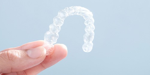 Patient holding clear aligner