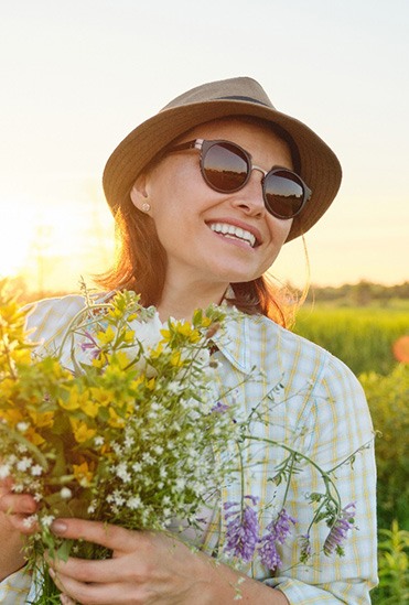 woman smiling with dental bridge in Flower Mound 