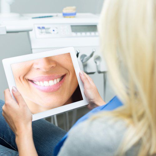 Woman looking at digital imaging on tablet computer