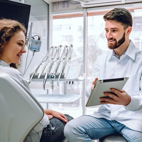 Woman at dentist for dental crown in Flower Mound