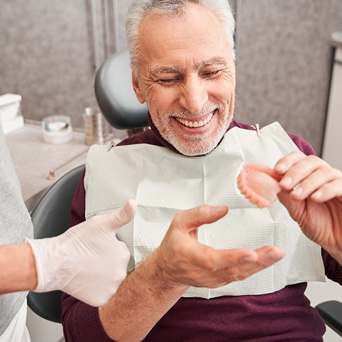 A man getting dentures made