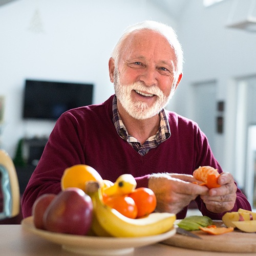A man eating an orange