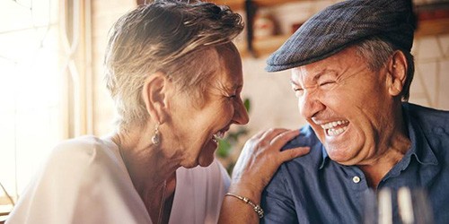 a couple enjoying benefits of dental implants in Flower Mound