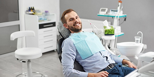 Male dental patient with dental implants in Flower Mound, TX during checkup