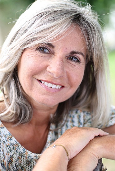 Beautiful woman with implant dentures in Flower Mound