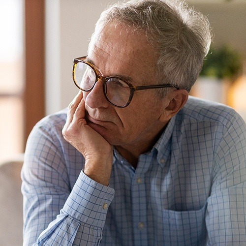 Man consdiering tooth replacement with dental implants