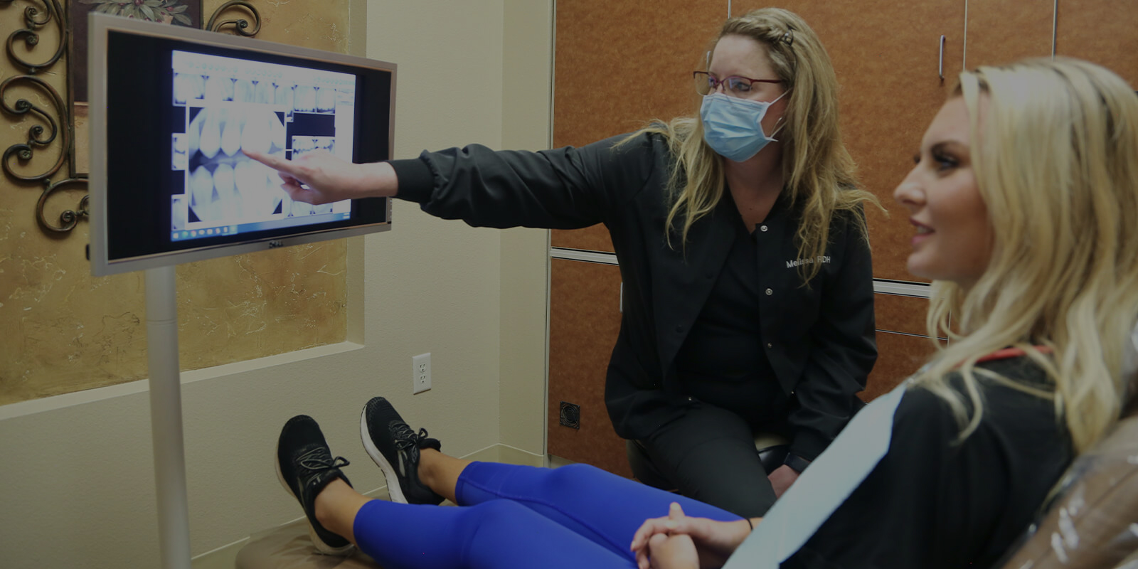 Flower Mound Texas dentist showing a dental patient x rays of their teeth
