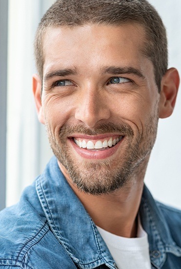 Man sharing healthy smile after gum disease treatment