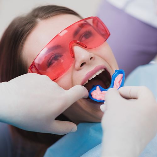 Dental patient receiving fluoride treatment