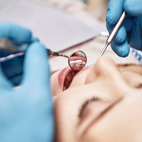 a patient undergoing an oral cancer screening