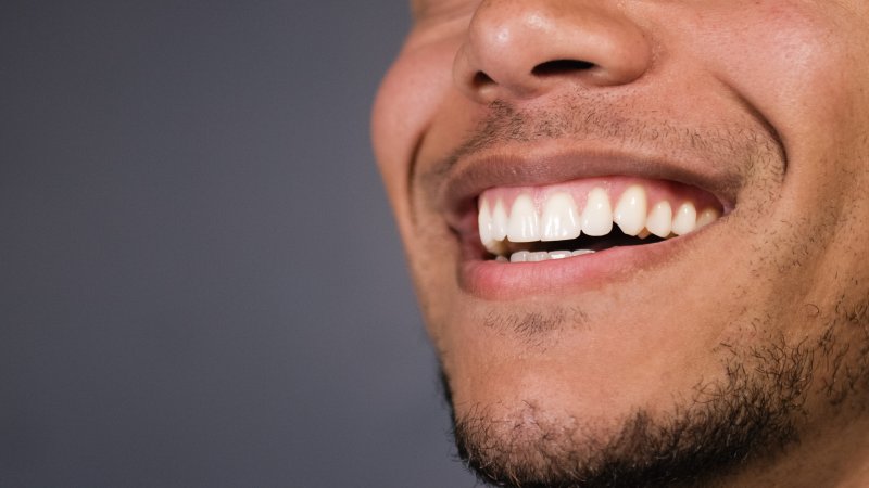 Man smiling with dental crown