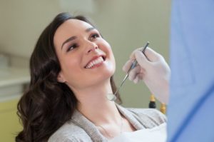 Smiling woman in dentist’s chair