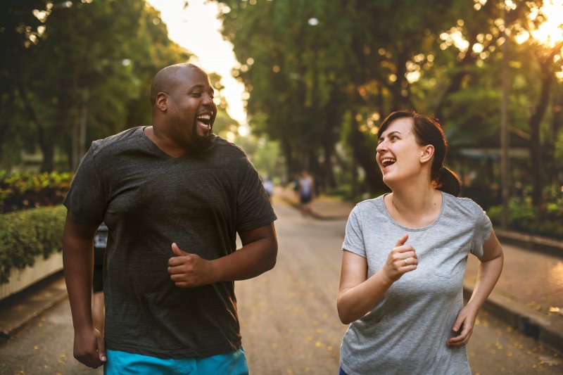 man and woman exercising 