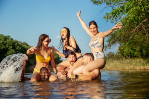 Group of family and friends having fun at the lake