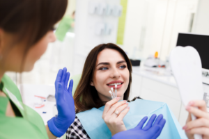 a patient examining their smile during a dental appointment