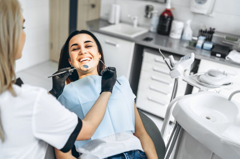 Patient smiling at emergency dentist